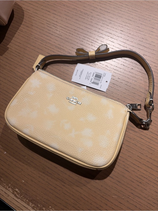 Coach Handbags - Coach Pale Yellow and White Leather Wristlet new